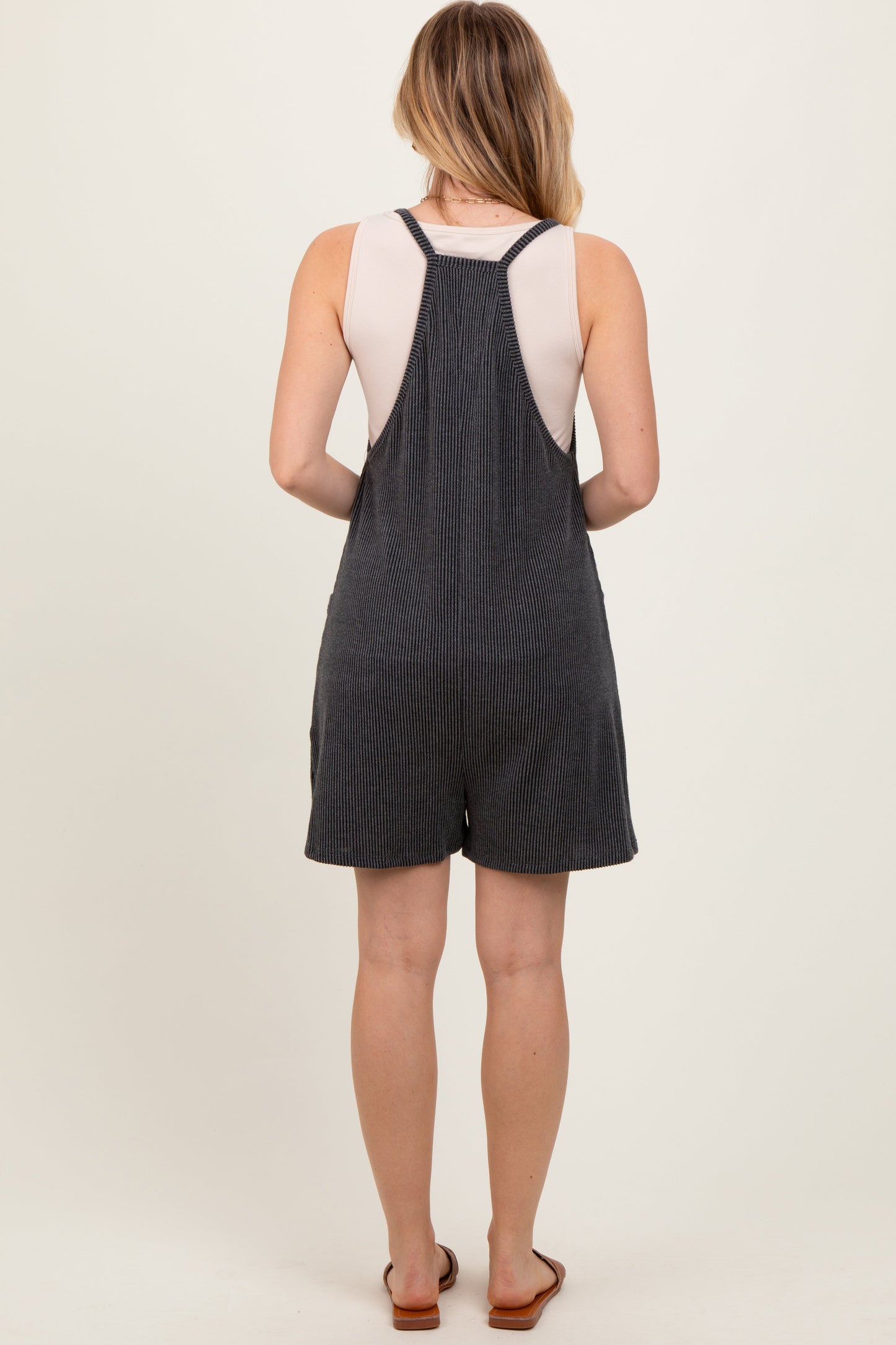Black Solid Ribbed V-Neck Sleeveless Front Pocket Romper